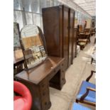 AN OAK THREE PIECE BEDROOM SUITE - A DRESSING TABLE, WARDROBE AND DRESSING CABINET