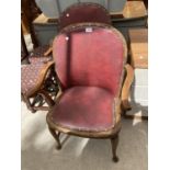 TWO OAK ARMCHAIRS WITH RED LEATHERETTE UPHOLSTERY