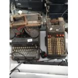 A VINTAGE ROYAL TYPEWRITER TOGETHER WITH A VINTAGE ADDING MACHINE