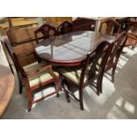 A MAHOGANY DINING TABLE WITH FOUR CHAIRS AND TWO CARVERS