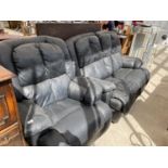 A BLACK TWO SEATER SOFA AND ARMCHAIR