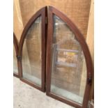 A LARGE TWO SECTION ARCHED WINDOW