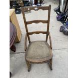 AN OAK ROCKING CHAIR