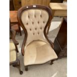 A MAHOGANY BUTTON BACK NURSING CHAIR