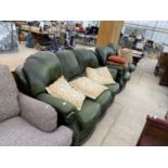 A GREEN LEATHER THREE SEATER SOFA AND TWO ARMCHAIRS