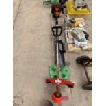 A PETROL STRIMMER WITH ATTACHMENTS