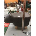 A BROWN HIPPO FAUX LEATHER FOOTSTOOL
