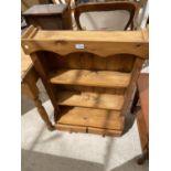 A PINE SHELF WITH TWO DRAWERS