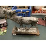 A WOODLAND DEER FIGURE ON A PLINTH