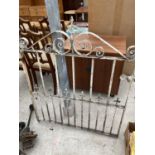 A WHITE WROUGHT IRON GATE