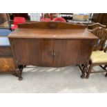 AN OAK SIDEBOARD WITH TWO DOORS