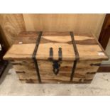 A WOODEN STORAGE CHEST