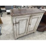 A PAINTED PINE CABINET WITH TWO DOORS
