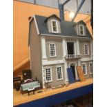 A ALRGE DOLLS HOUSE WITH FURNITURE