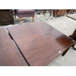 A SQUARE MAHOGANY COFFEE TABLE