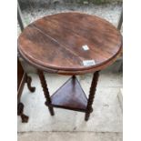 A MAHOGANY AND OAK SIDE TABLE ON TURNED SUPPORTS