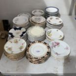 A LARGE QUANTITY OF CHINA PLATES WITH VARIOUS DESIGNS