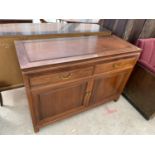 AN OAK SIDEBOARD WITH TWO DOORS AND TWO DRAWERS