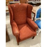 A WING BACK ARMCHAIR