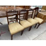 FOUR CARVED MAHOGANY DINING CHAIRS