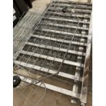 A CHROME RAIL AND WIRE PANELS