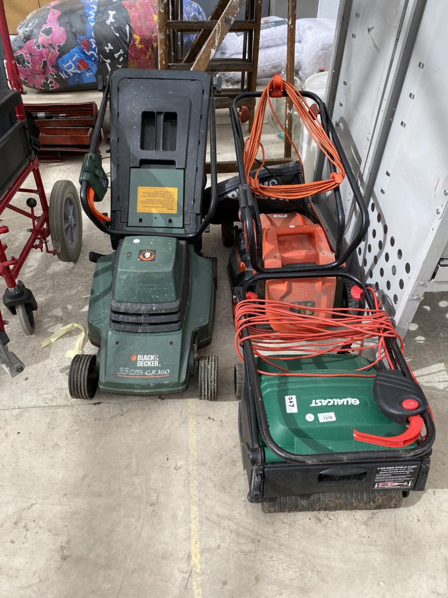 AN ELECTRIC SCARIFIER AND TWO LAWN MOWERS, ALL IN WORKING ORDER