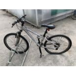 A TREK 4300 MOUNTAIN BIKE WITH A 24 SPEED GEAR SYSTEM