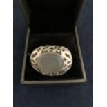 A LARGE DESIGNER SILVER RING WITH OVAL STONE