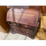 A MAHOGANY BUREAU WITH FALL FRONT, TWO SHORT AND THREE LONG DRAWERS