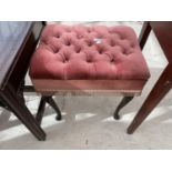 AN UPHOLSTERED FOOTSTOOL