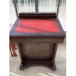 A MAHOGANY DAVENPORT WITH HINGED TOP WITH RED LEATHER WRITING SURFACE, INKWELL AND FOUR SIDE DRAWERS