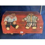 A WOODEN TOY BOX PAINTED WITH TEDDY BEARS CONTAINING A DOLL AND A TEDDY