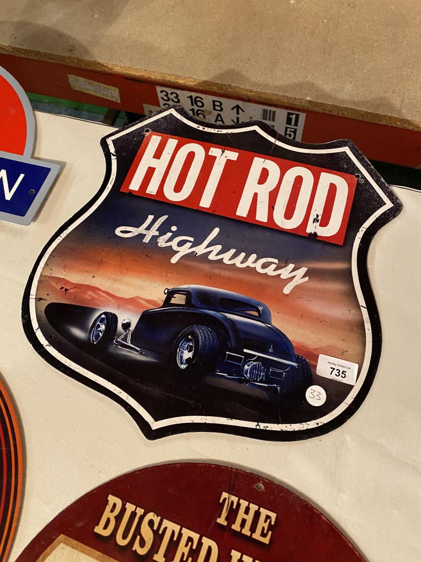 A HOT ROD HIGHWAY METAL ADVERTSING SIGN