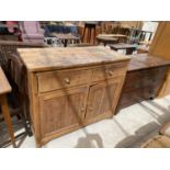 A PINE SIDEBOARD WITH TWO DOORS AND TWO DRAWERS