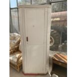 A WHITE PAINTED CORNER WARDROBE