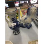 A BLUE AND WHITE VASE AND A STAFFORDSHIRE STYLE DOG