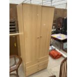 A PINE EFFECT WARDROBE WITH TWO DOORS AND THREE DRAWERS