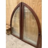 A LARGE TWO SECTION ARCHED WINDOW