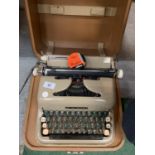 A VINTAGE CASED TYPE WRITER