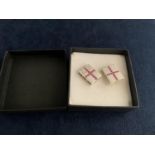 A PAIR OF BOXED SILVER AND RUBY CUFFLINKS