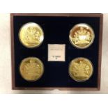 CASED SET OF FOUR QUEEN E COMM COINS