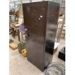 A METAL SINGLE DOOR CABINET