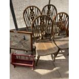 A MAGAZINE RACK, A TAPESTRY FIRE SCREEN AND FOUR OAK WHEEL BACK DINING CHAIRS