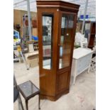 A YEW WOOD CABINET WITH LOWER DOOR AND UPPER GLAZED DOOR