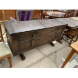 AN OLD CHARM OAK SIDEBOARD WITH TWO DOORS AND THREE DRAWERS
