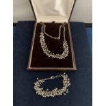 A BOXED NECKLACE AND BRACELET SET