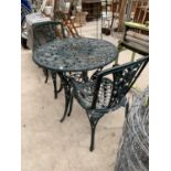 A CAST IRON ORNATE TABLE AND TWO MATCHING CHAIRS
