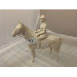 A BESWICK HUNTSWOMAN ON A GREY HORSE