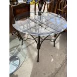 A GLASS TOPPED DINING TABLE