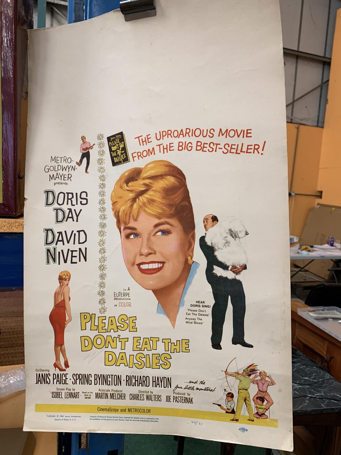 AN ADVERTISNG POSTER DORIS DAY AND DAVID NIVEN PLEASE DON'T EAT THE DAISIES